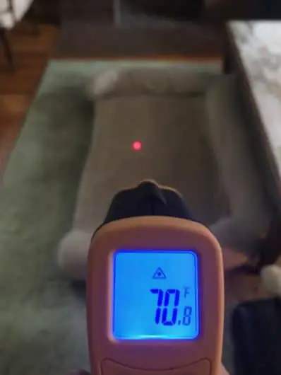 I place my dog's bed in the center of the room during winter months.  This image shows that the center of the room is warmer than the perimeter by 8 degrees. Using an infrared thermometer.
