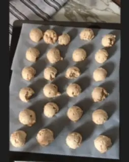 This is how you shape the 3 ingredient no bake dog treats. Drop them in balls onto a baking sheet